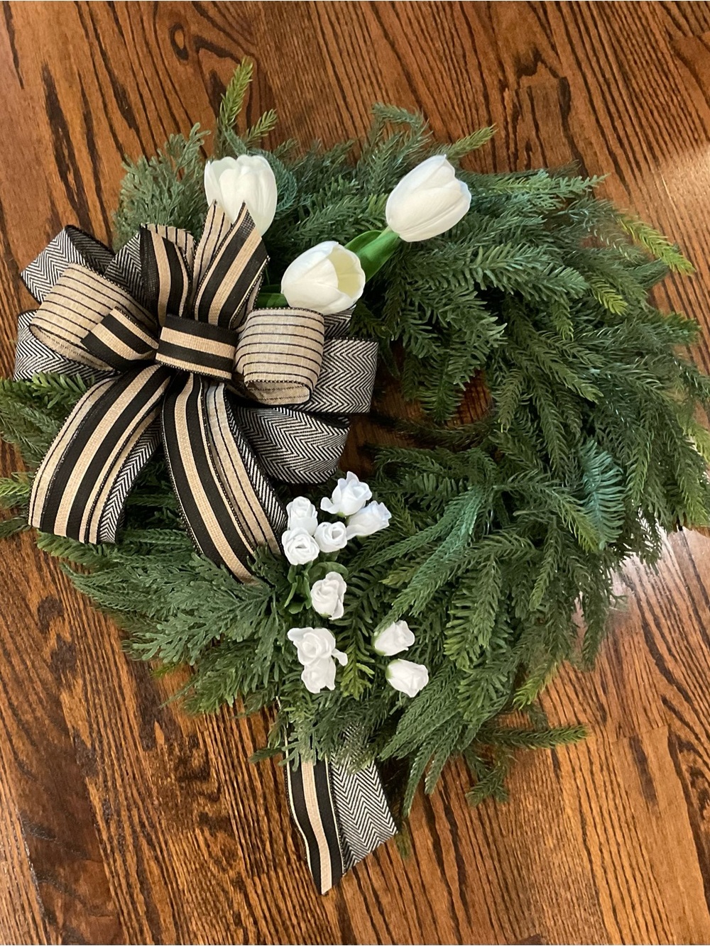 Handcrafted Green Holiday Wreath with White Tulips and Black-Striped Bow